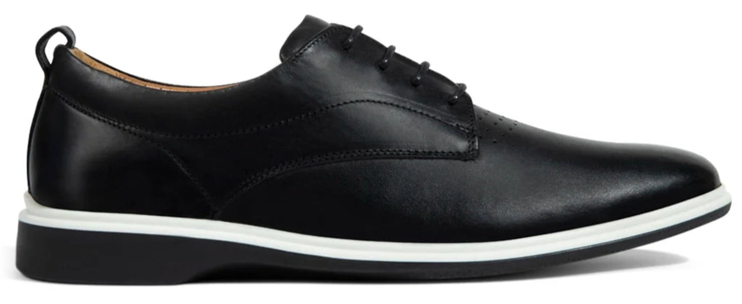 Black leather shoe with white sole on a white background